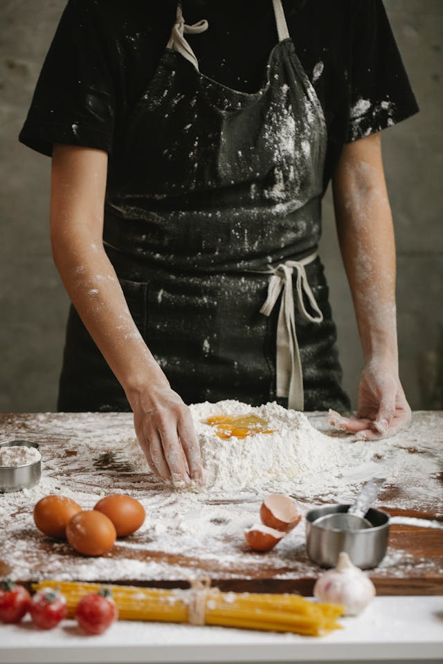 Black apron covered in flour - The Ultimate Guide to Choosing the Best Adult Bib