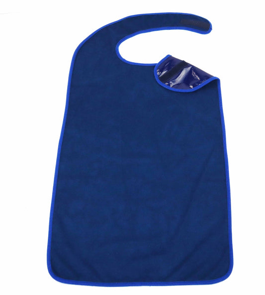 This image shows a solid blue adult bib with a smooth texture. The bib features an oversized design, intended to cover a large portion of the wearer's front. It has a contoured shape with a rounded neck cutout for comfort. At the neck, there is a visible dark blue, shiny Velcro strap used to secure the bib in place. The edges of the bib are neatly hemmed with a slightly lighter blue border, providing both contrast and reinforcement.